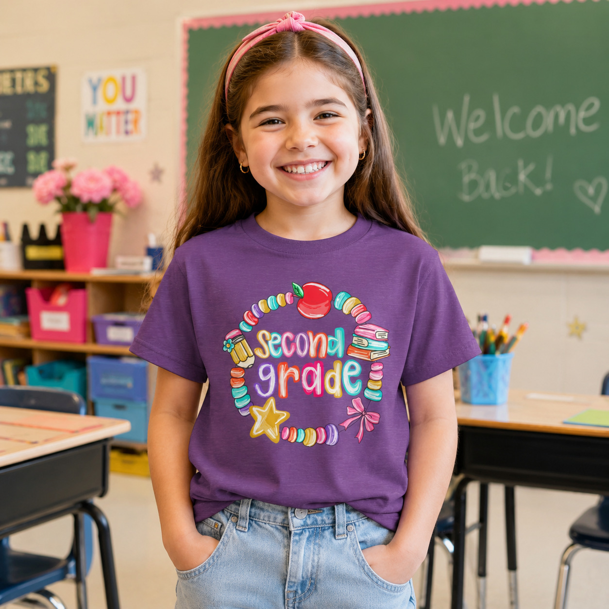Girl wearing a colorful second grade graphic tee in a classroom